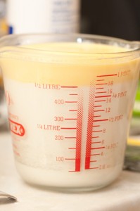Warm milk and melted margarine in a jug