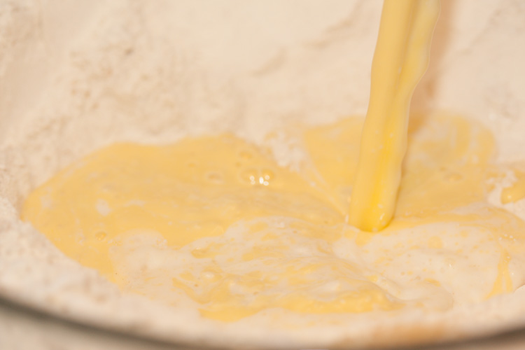 Pouring melted margarine and milk into flour Cake and Cookie Recipes