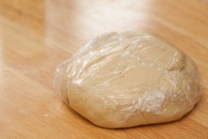 Dough covered in cling film resting