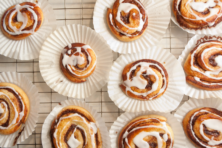 Cinnamon whirls with icing drizzled on top