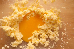 Add the beaten egg yolks
