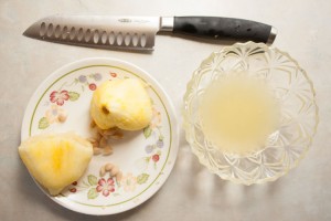 Juiced lemon with lemon juice in a bowl and knife
