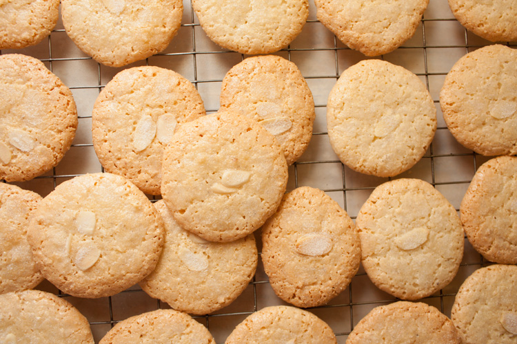 Almond Macaroon Cookies on a wire rack, cooling after baking.