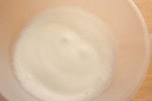 Whisked egg whites after adding part of the sugar